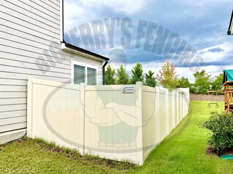 Enhance your outdoor living space with the Tan Vinyl tongue and groove privacy fence, a durable and low-maintenance neutral alternative that complements home color palettes and wooded environments, perfect for adding aesthetic appeal and curb appeal to homes with heavy tree coverage and vegetation.