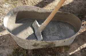 Hand mixing concrete