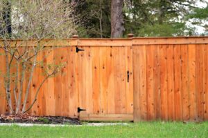 Wooden stained fence made out of lumber